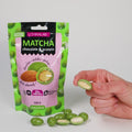 Chocolate covered almonds with green matcha tea